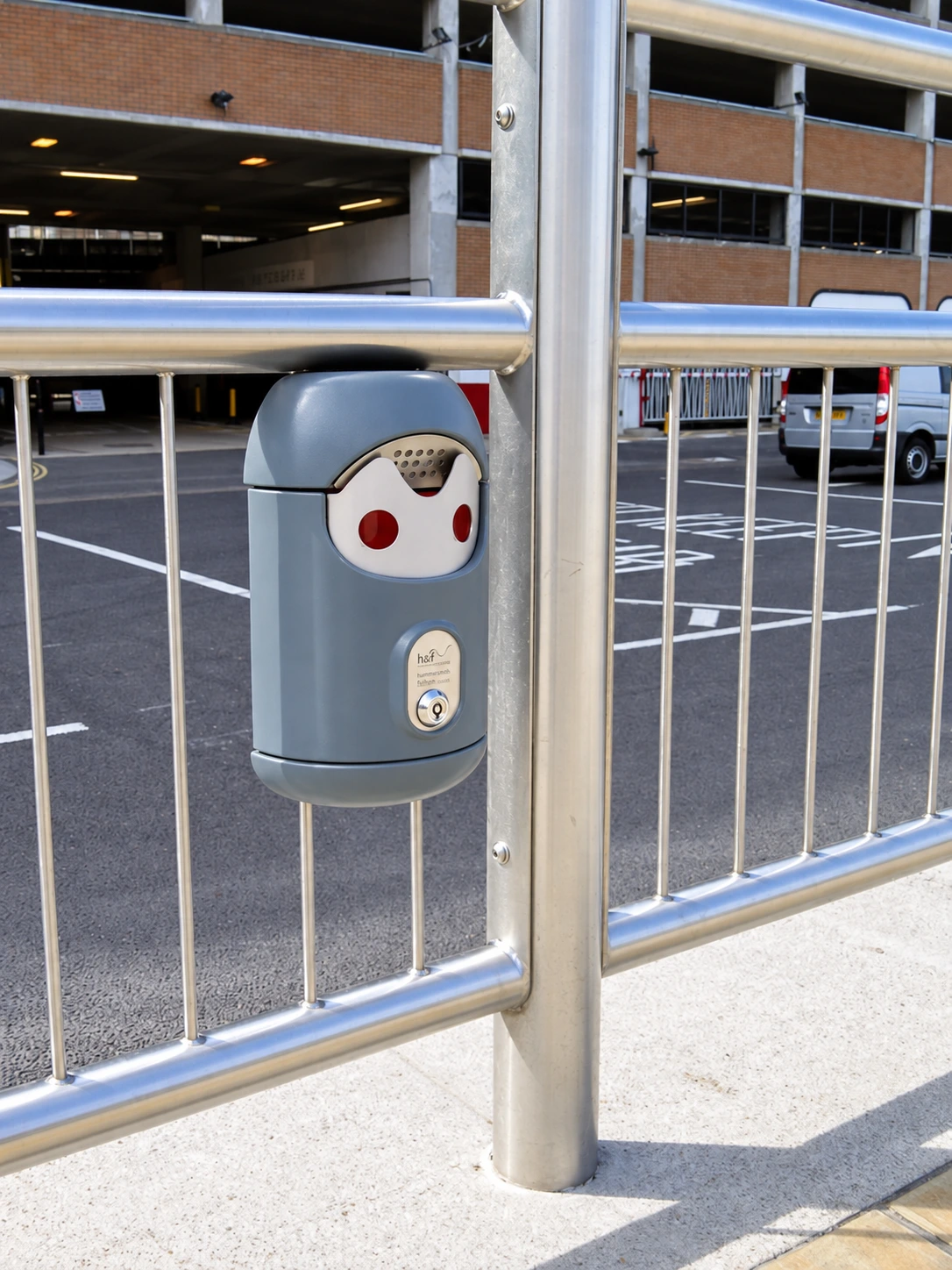 Railing-mounted Smartbin cigarette and chewing gum bins