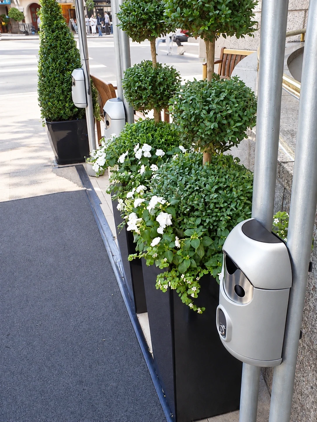 Railing-mounted Smartbin cigarette and chewing gum bins