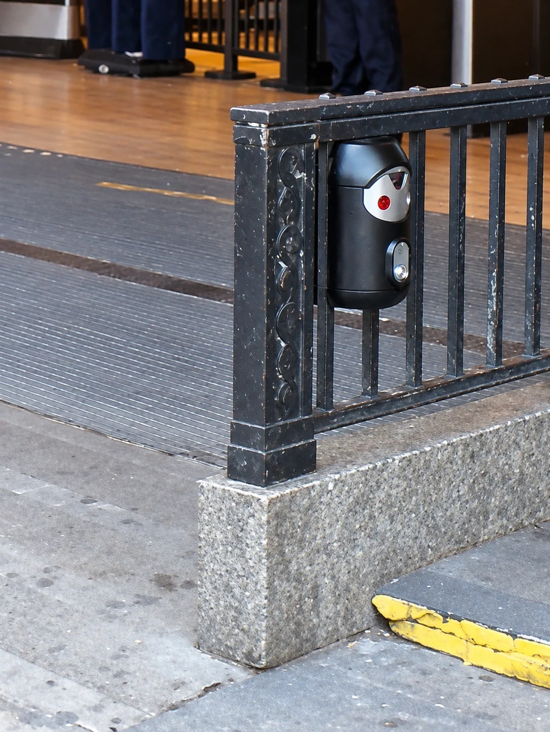 Railing-mounted Smartbin cigarette and chewing gum bins