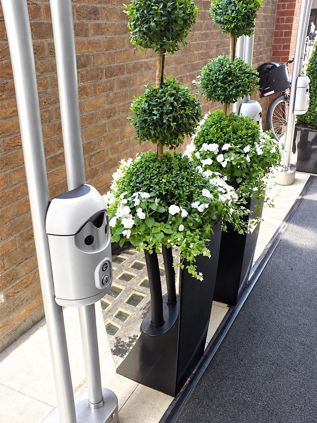 Railing-mounted Smartbin cigarette and chewing gum bins